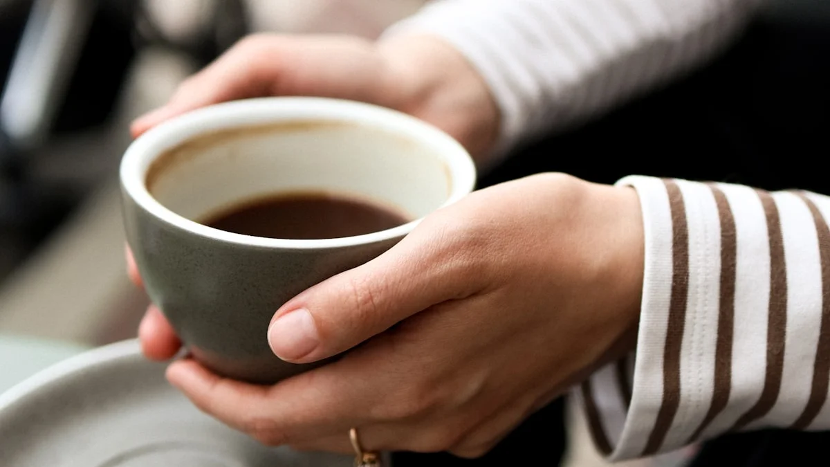 Hands cradling a warm ceramic mug in soft light, a held moment before answering - a Quiet Core Reset guide to The 90-Second Pause Before You Say Yes.