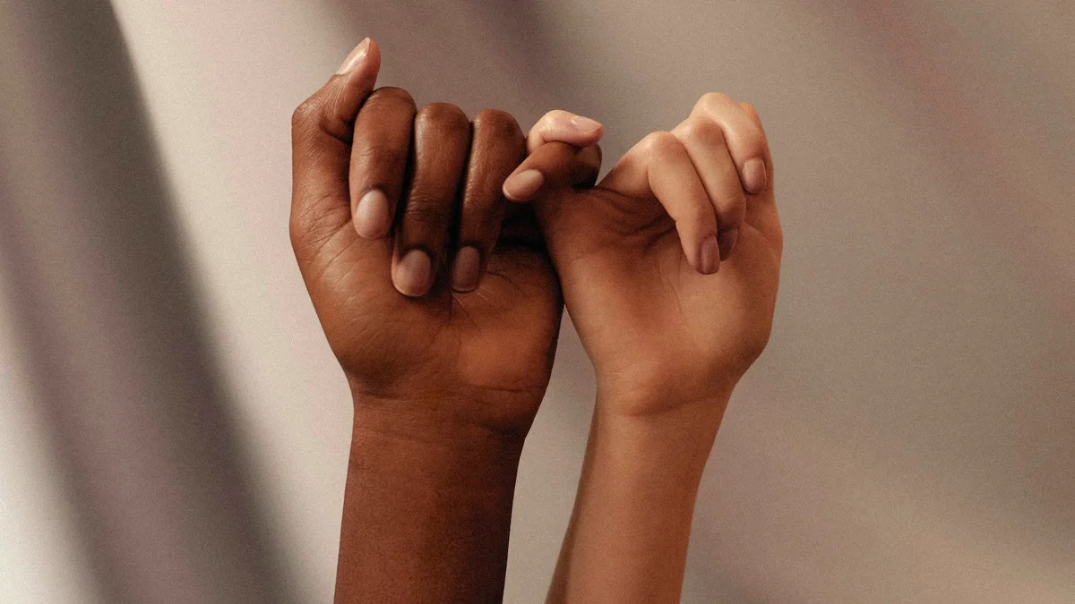 Two hands linking pinky fingers in a quiet promise - a Quiet Core Reset guide to 90-Second Self-Compassion Break for Hard Moments.