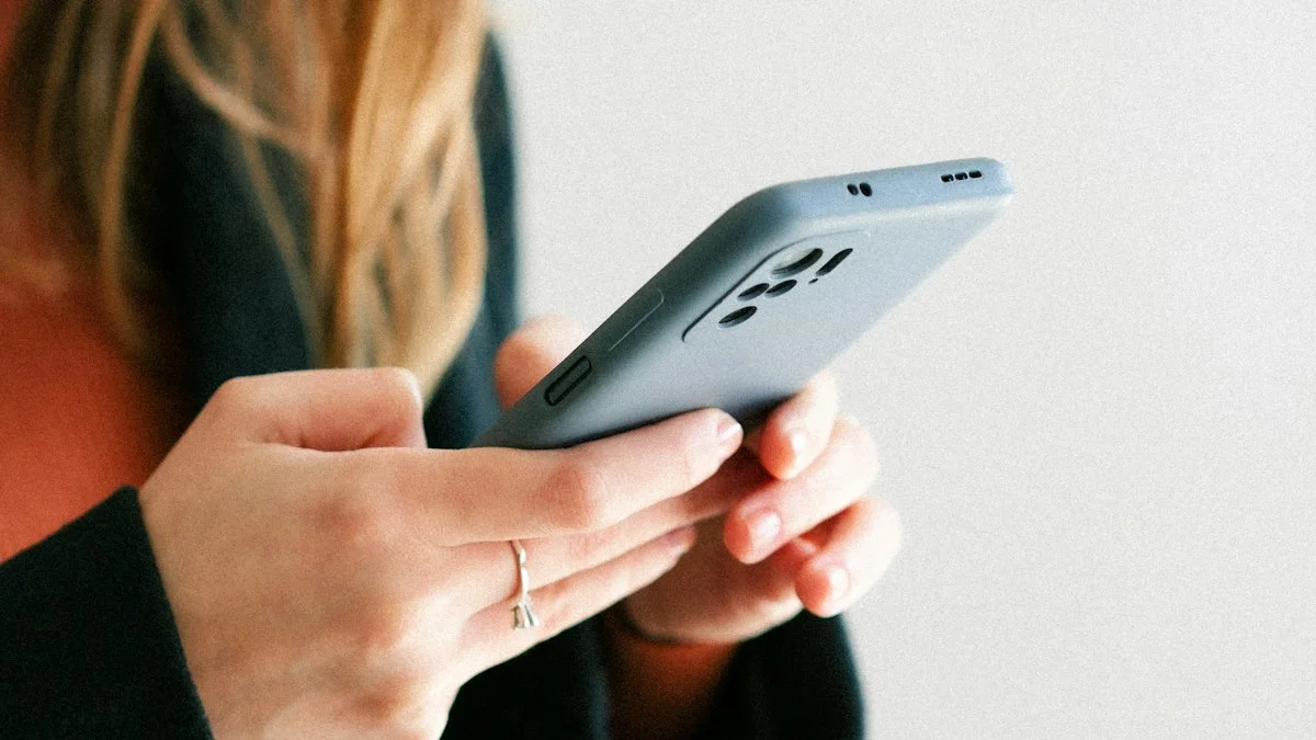 A person's hands holding a phone mid-scroll against a pale wall, soft muted light - a Quiet Core Reset guide to Before You Scroll: A 5-Second Pause That Changes Everything.