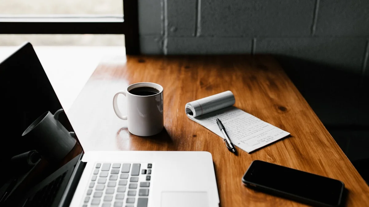 A tidy wooden desk by a window with a laptop, coffee mug, notepad, and pen - a Quiet Core Reset guide to 5 Mistakes People Make When Breaking the Comparison Habit.