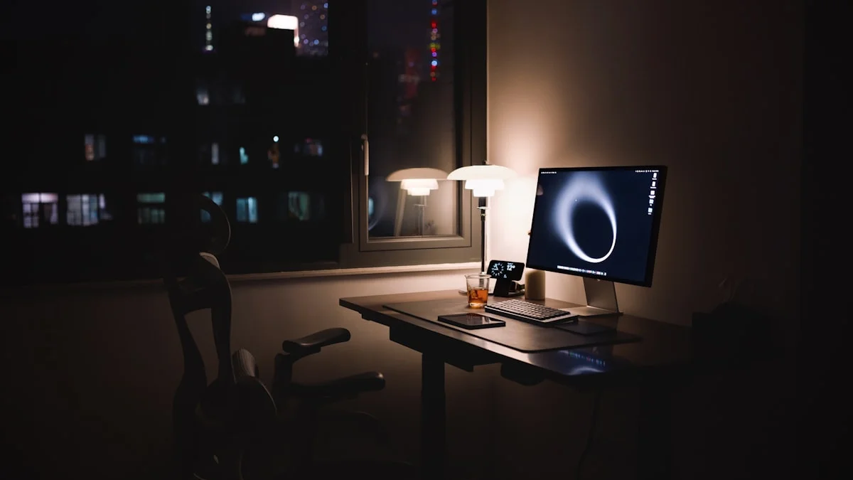 A quiet office desk lit by a lamp at night with an empty chair and city lights in the window - a Quiet Core Reset guide to Comparison at Work.