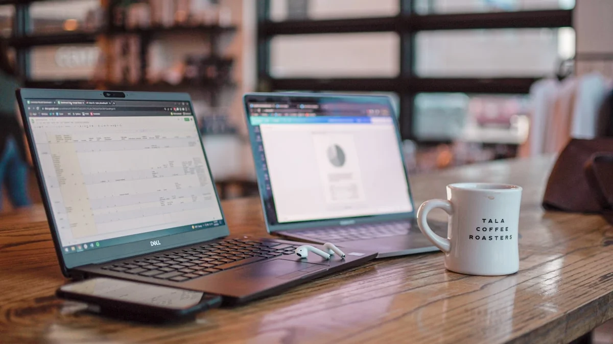 Two open laptops side by side on a wooden cafe table with a phone, earbuds, and a coffee mug - a Quiet Core Reset guide to Context Switching Is Killing Your Energy.