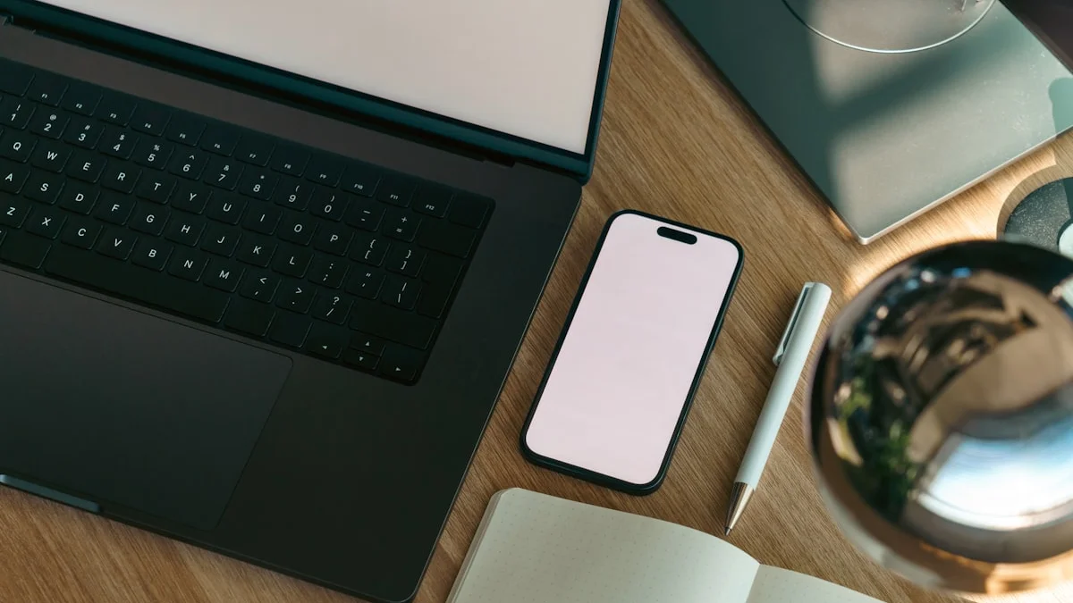 A phone, pen, and open notebook resting on a sunlit wooden desk beside a laptop - a Quiet Core Reset guide to How to Curate Your Feed.