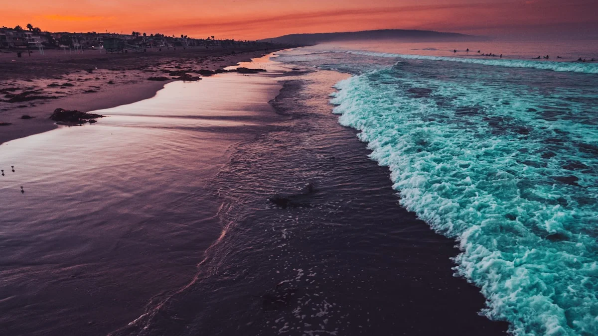 Gentle waves rolling onto a shore under a warm sunset sky, steady and unhurried - a Quiet Core Reset guide to What Real Emotional Resilience Looks Like.