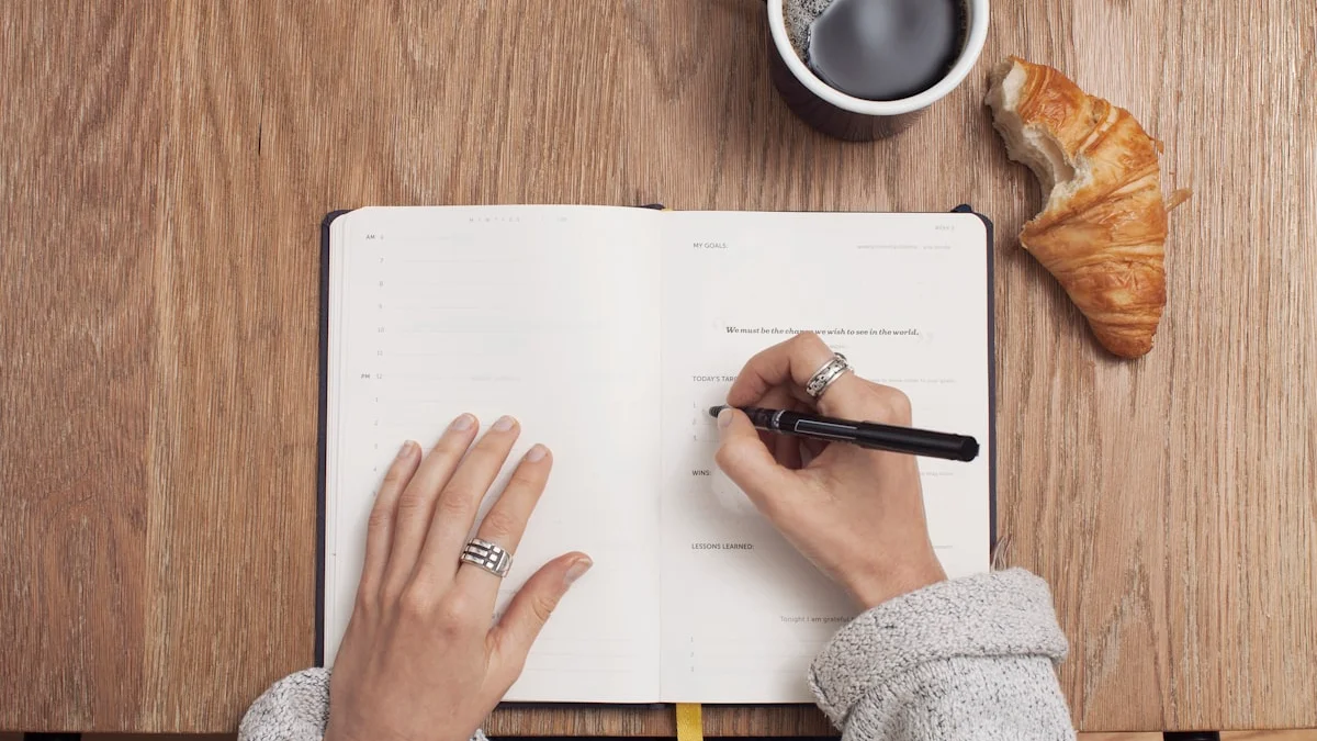 Hands writing in an open notebook beside a coffee cup and a croissant on a warm wooden table - a Quiet Core Reset guide to the Emotional Toolkit.