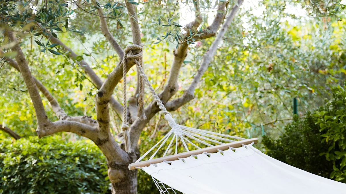 An empty white hammock strung in a leafy tree, dappled light on the leaves - a Quiet Core Reset guide to How to Escape ‘Hustle Mode’ in 10 Minutes a Day.