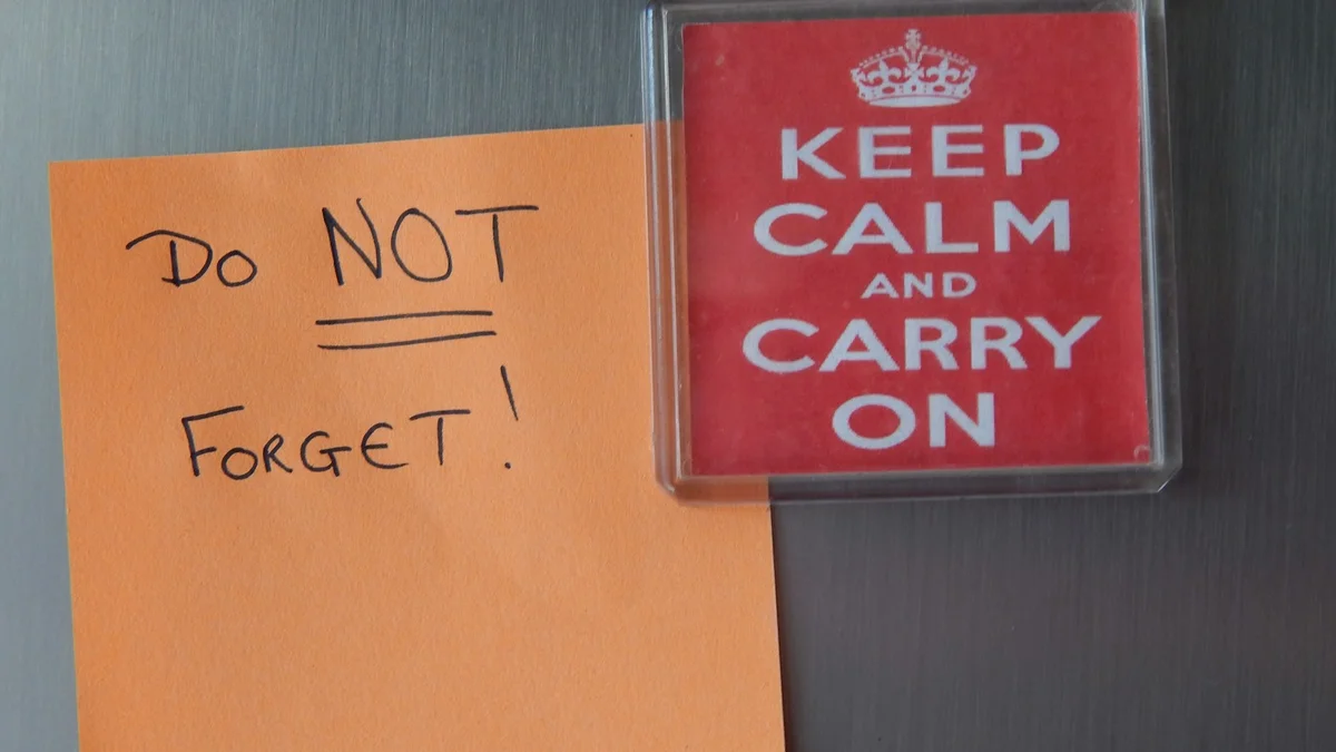 A handwritten reminder note hanging on the refrigerator door - a Quiet Core Reset guide to Family Energy Checklist.