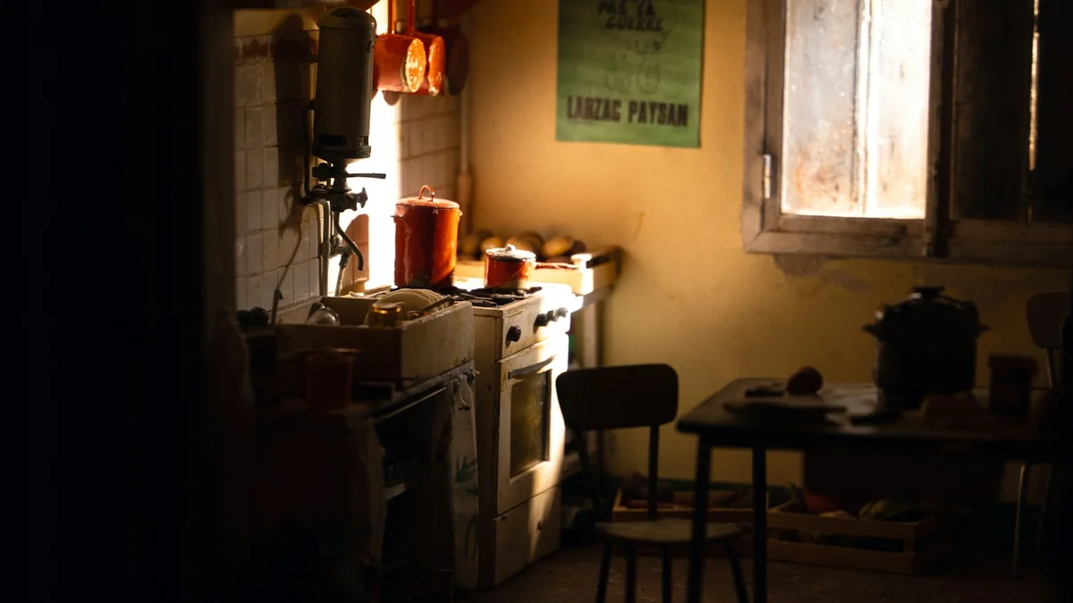 A dim kitchen lit by a single warm lamp at night - a Quiet Core Reset guide to 9 Signs of a Family Energy Drain (It's Not Just Being Tired).