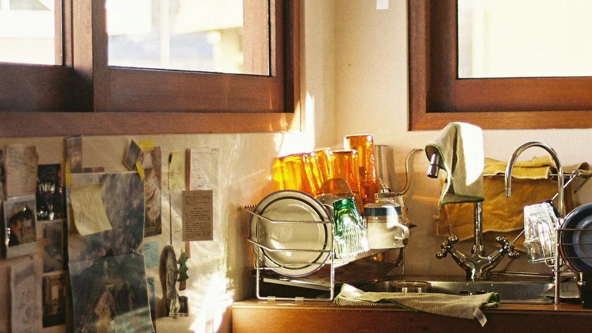 Sunlight falling across a lived-in kitchen sink and counter - a Quiet Core Reset guide to 6 Family Energy Mistakes That Keep You Drained (Gentle Fixes).