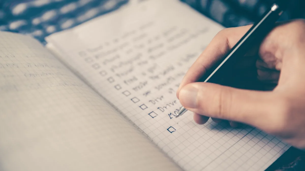 A hand writing a checkbox list in a grid notebook with a pen in soft, muted light - a Quiet Core Reset guide to The Feed Audit: A Free Comparison Checklist.