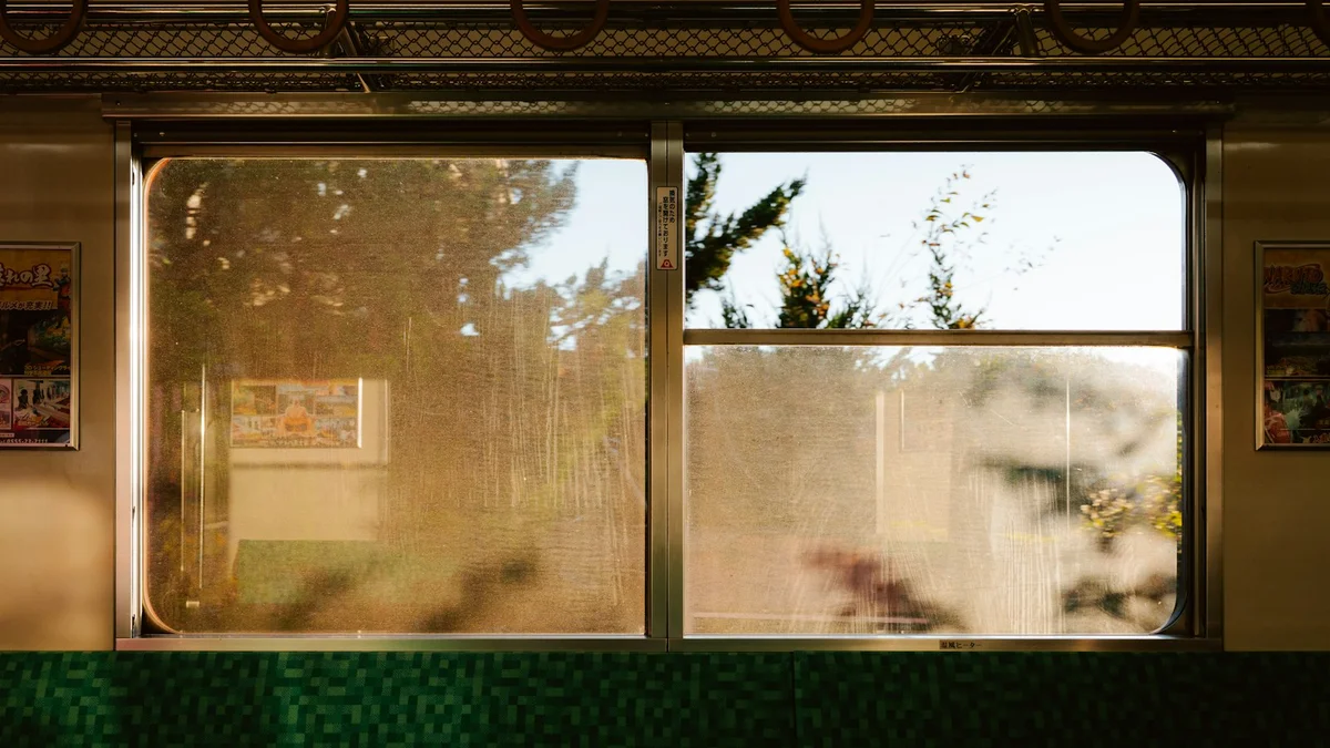 The warm interior of a commuter train with sunlight in the windows - a Quiet Core Reset guide to How I Stopped Being the Go-To Person at Work (and Got My Energy Back).