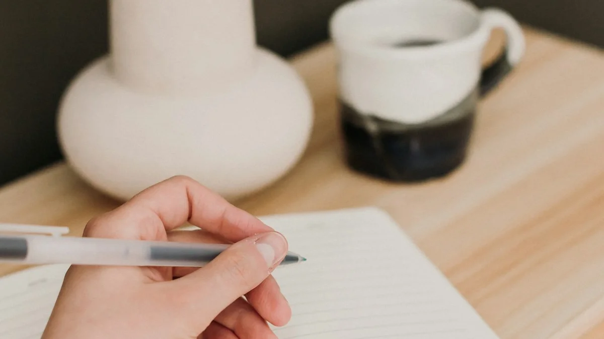 A hand beginning a simple journal entry in an open notebook beside a ceramic mug - a Quiet Core Reset guide to Beginner's Guide to High-Functioning Exhaustion.