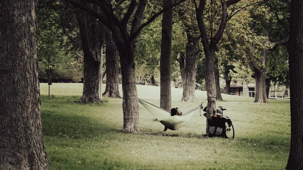 A person resting in a hammock strung between trees in a quiet, green park - a Quiet Core Reset guide to The Science of High-Functioning Exhaustion: Survival Mode.