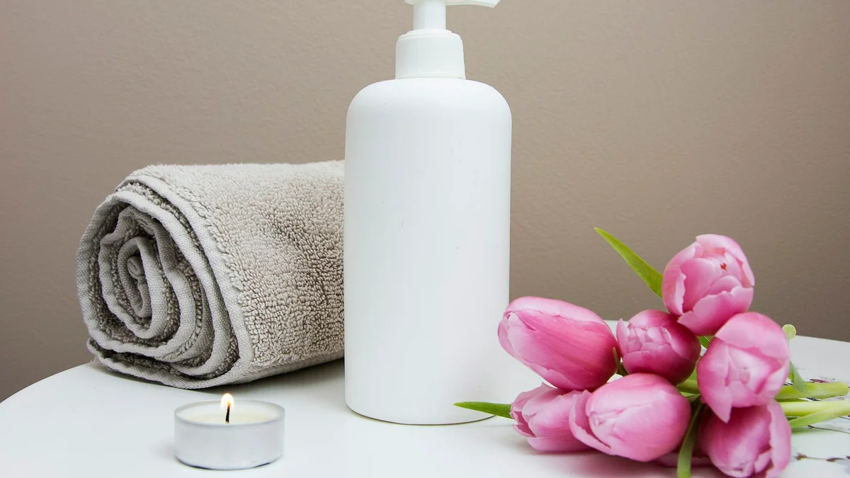 A spa setting with folded towels and a white orchid, calm and neutral - a Quiet Core Reset guide to How to Slow Down When Everything Feels Urgent.