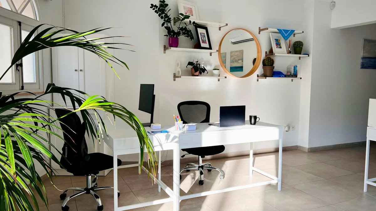 A bright calm office with plants and soft daylight - a Quiet Core Reset guide to How to Quiet Your Inner Critic at Work (Without Losing Your Edge).