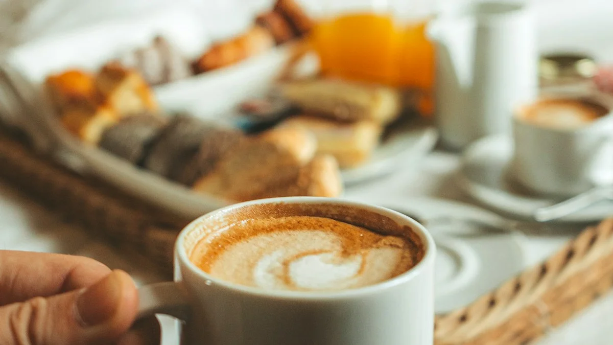 A hand holding a mug of latte beside a small breakfast tray on a white bed - a Quiet Core Reset guide to Low-Energy Day Plan for High-Functioning Exhaustion.