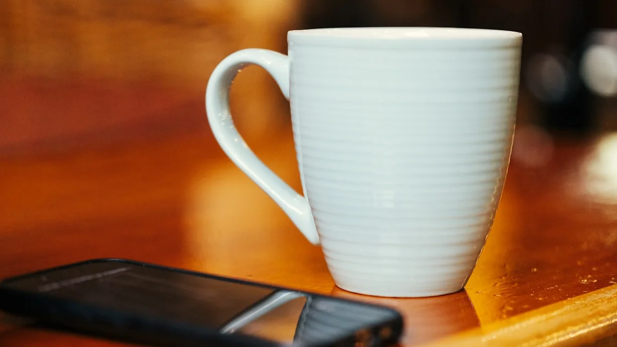 A white coffee mug on a warm wooden counter beside a smartphone lying face down and ignored - a Quiet Core Reset guide to Mindful Consumption.