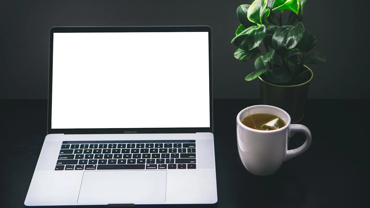 A glowing laptop, a plant, and a mug of tea on a dark desk late in the evening - a Quiet Core Reset guide to Nervous System Regulation for Entrepreneurs & High Performers.