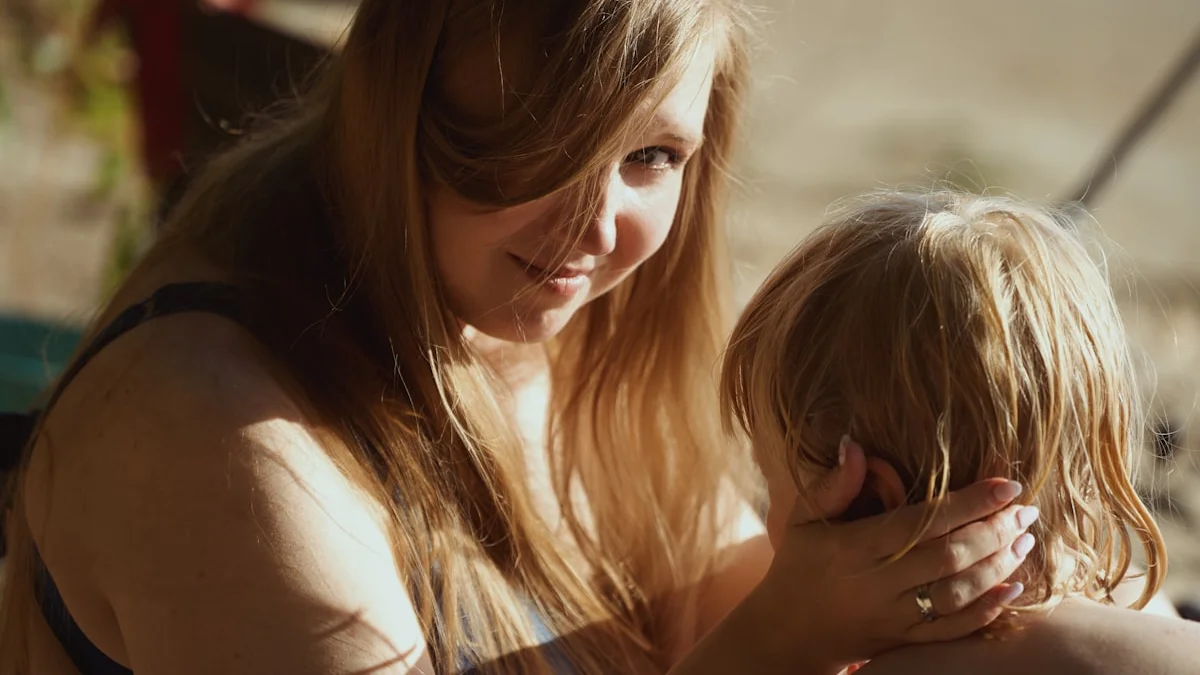A mother in warm afternoon sun holding her young child close in a quiet moment together - a Quiet Core Reset guide to Nervous System Regulation for Parents & Caregivers.