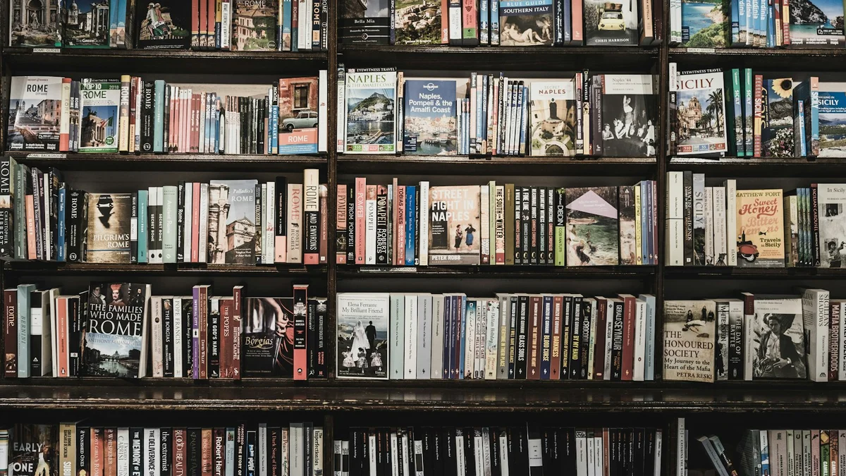 Floor-to-ceiling bookshelves packed with books, a warm library wall - a Quiet Core Reset guide to People-Pleasing.