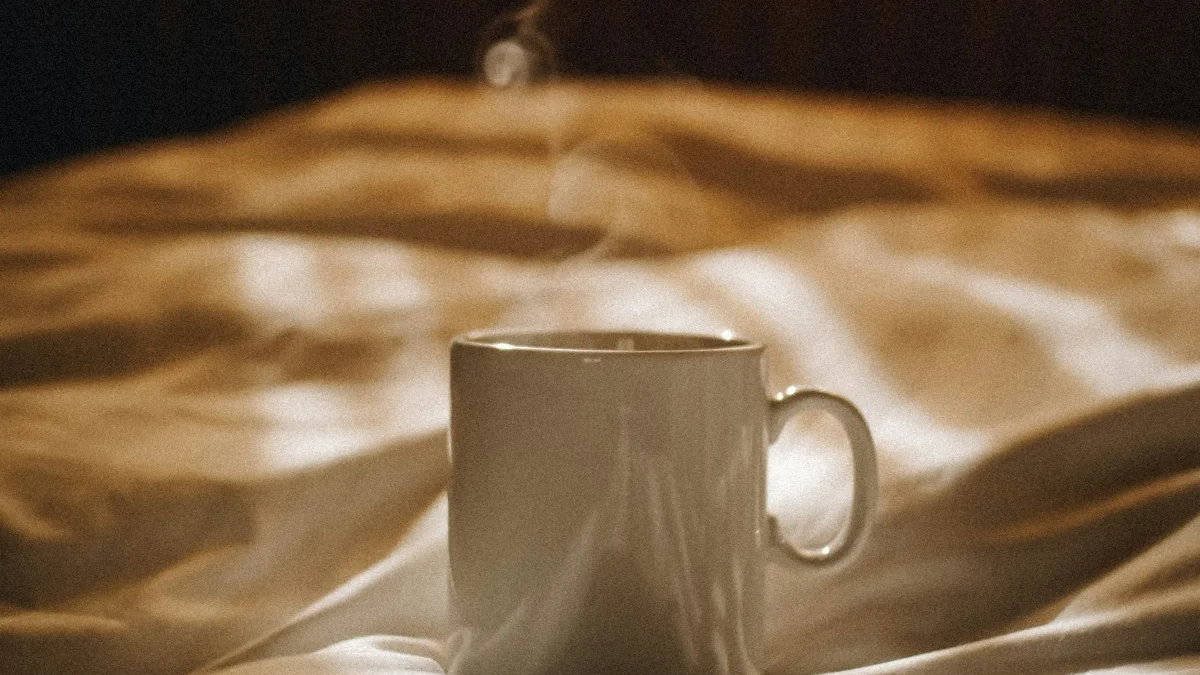 A steaming mug resting on a rumpled duvet in soft golden morning light - a Quiet Core Reset guide to recovering from high-functioning exhaustion.