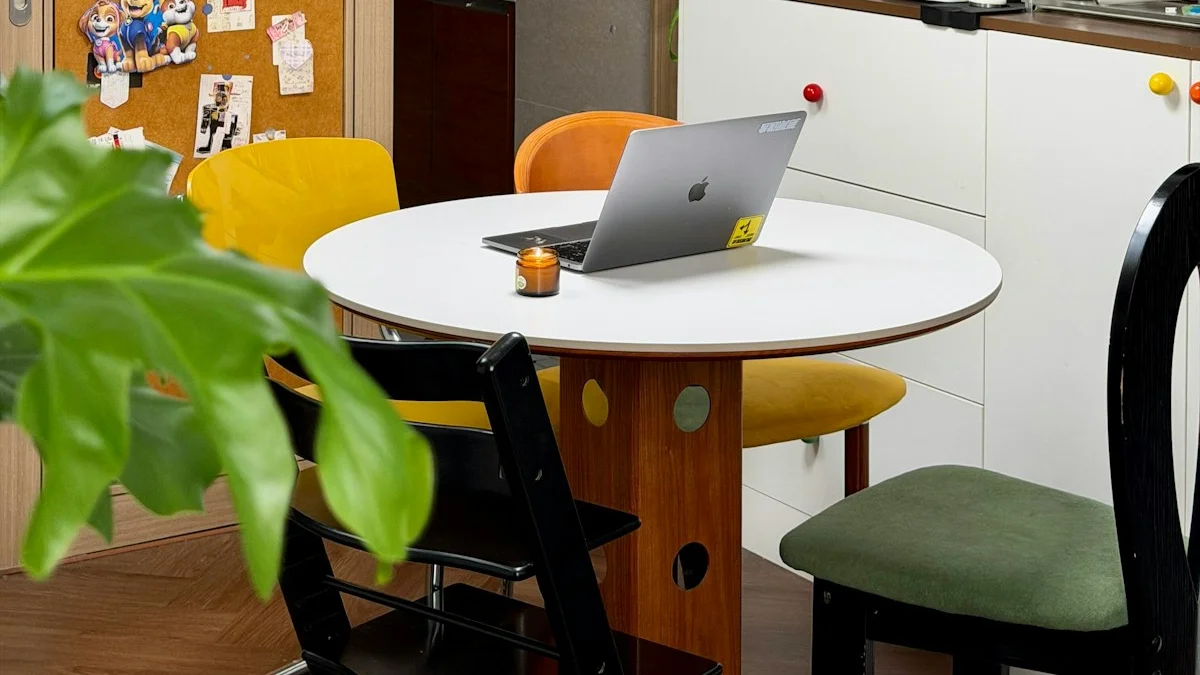 A laptop open on a round kitchen table surrounded by dining chairs and houseplants - a Quiet Core Reset guide to Regulating Your Nervous System When You Work From Home.