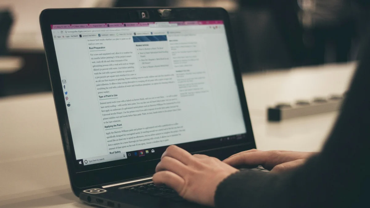 Hands typing on a laptop in soft, muted light - a Quiet Core Reset guide to Sleep Recovery at Work.
