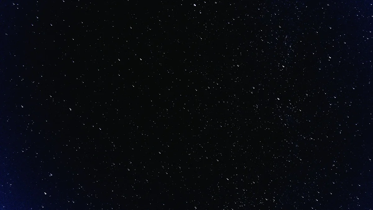 A quiet night sky full of stars above a mountain horizon - a Quiet Core Reset guide to Science of Sleep Recovery.