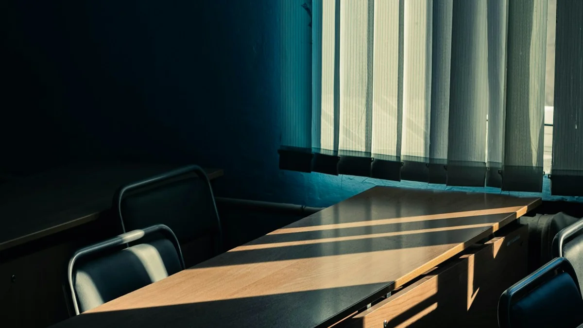 Low sunlight streaming across an empty wooden desk beside tall office windows - a Quiet Core Reset guide to Slow Living at Work.