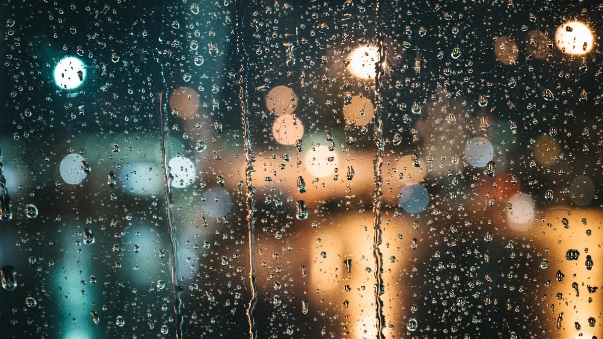 Raindrops streaking a window at night with warm city lights glowing softly behind - a Quiet Core Reset guide to What Your Emotions Are Trying to Tell You.