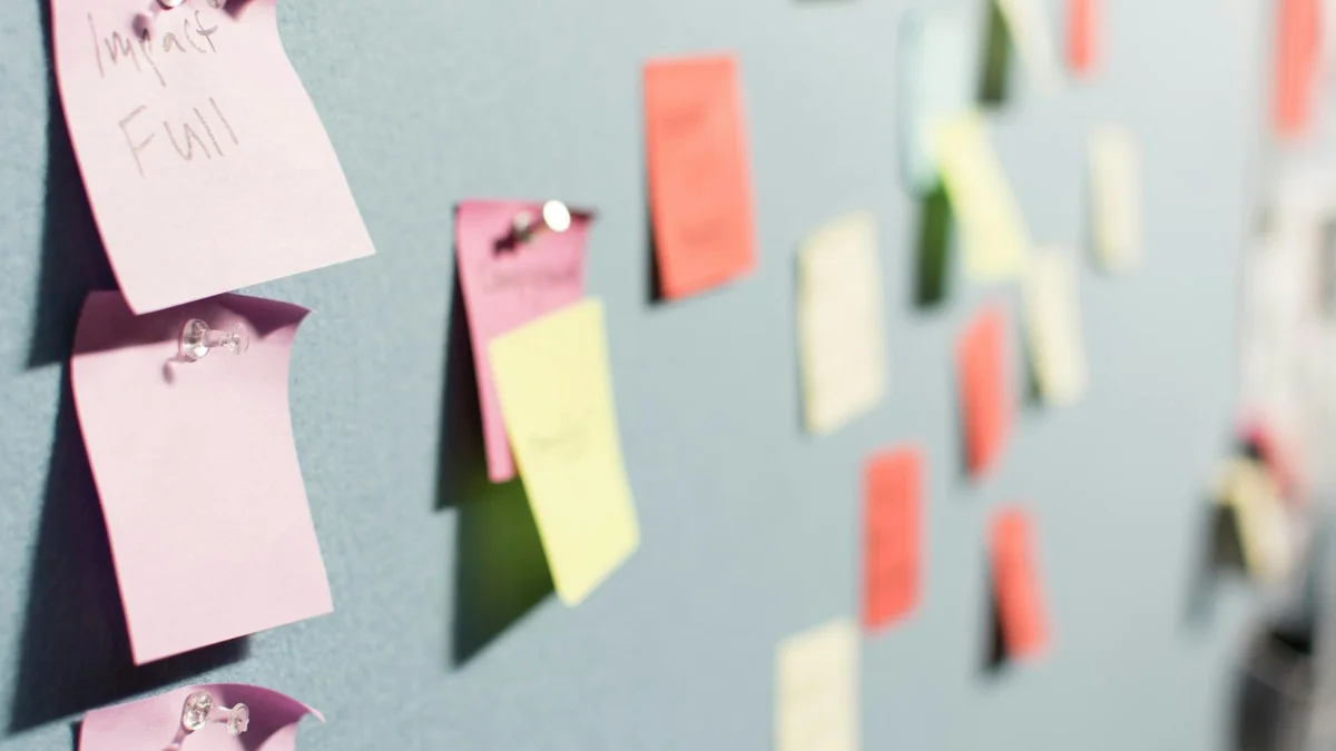 A board covered in soft-colored sticky notes - a Quiet Core Reset guide to Why Your Work Energy Disappears.