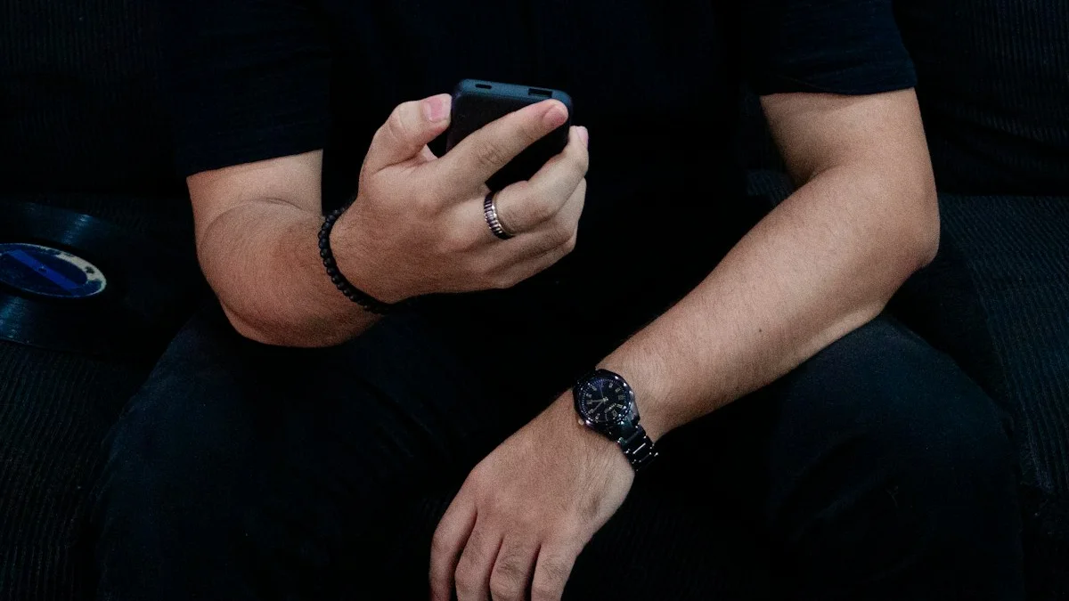 A person absorbed in their phone in a darkened room, face lit dimly - a Quiet Core Reset guide to Your Brain on Notifications.